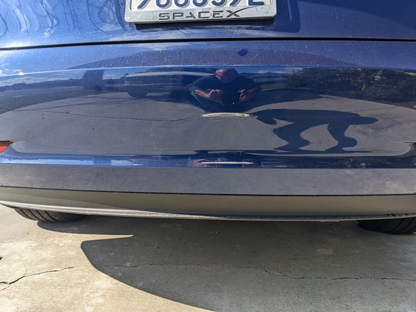 Tesla Blue model 3 rear bumper dent