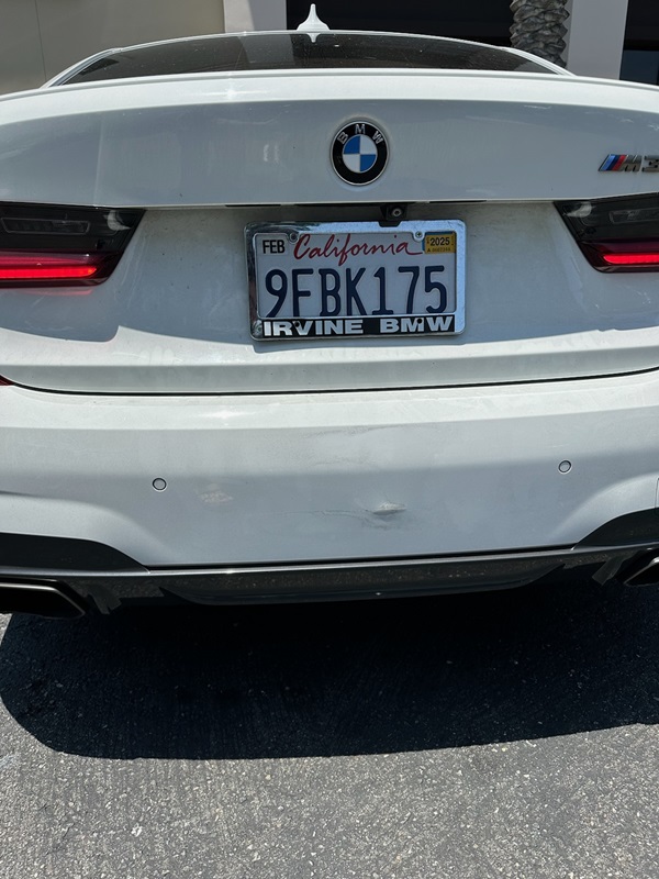 BMW M3 rear bumper dent