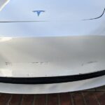 Tesla model 3 bumper crease dent